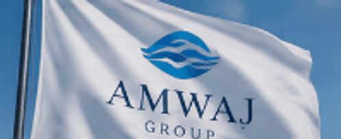 The Amwaj Group official flag waving against clear sky